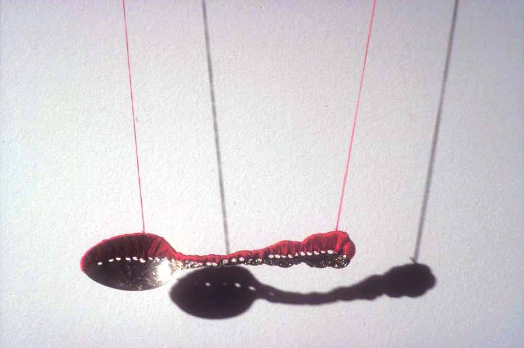 Rae Goodwin, "constrain." sterling silver spoon, 300 yards cotton thread, needles and shadow.18”x 10”x 1” (2005)